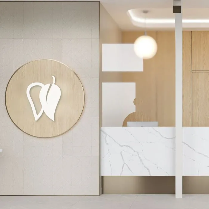 Reception desk and logo wall at Yonge Forest Dental in Barrie
